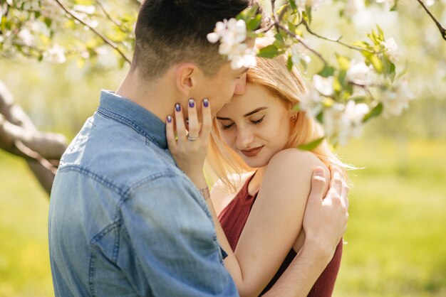 Beautiful couple spend time in a summer park