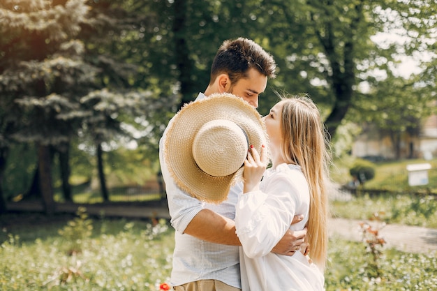 Beautiful couple spend time in a summer park