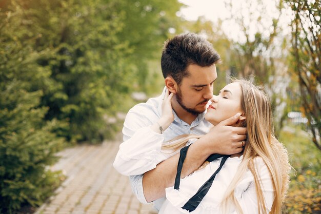 Beautiful couple spend time in a summer park