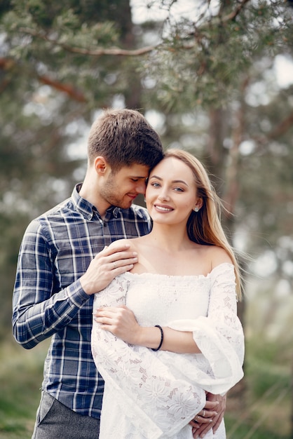 Beautiful couple spend time in a summer park