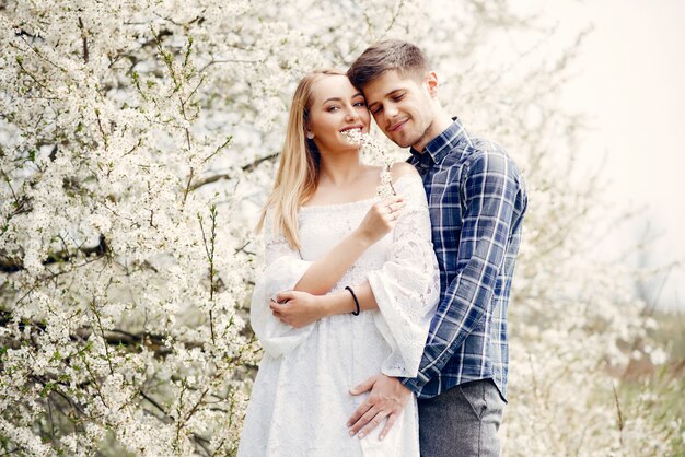 Beautiful couple spend time in a summer park