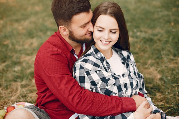 Beautiful couple spend time in a summer park