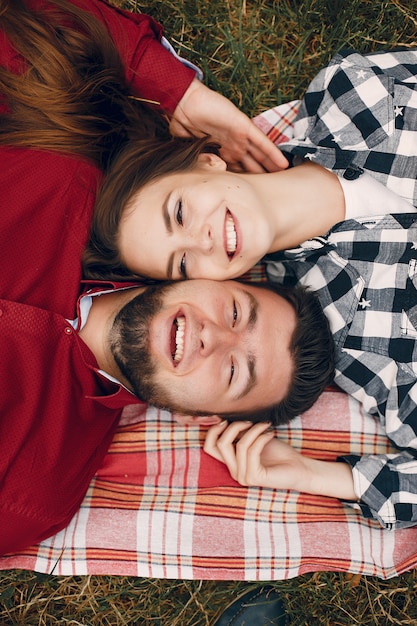 Beautiful couple spend time in a summer park