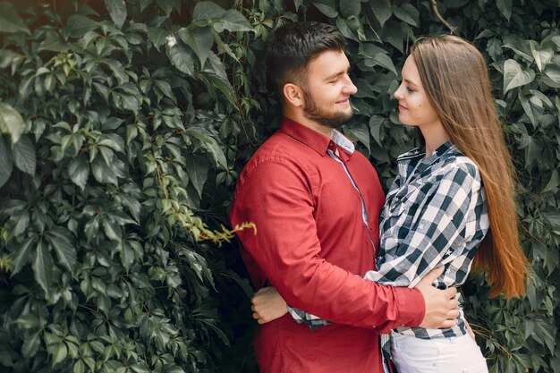 Beautiful couple spend time in a summer park