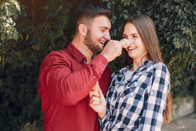 Beautiful couple spend time in a summer park