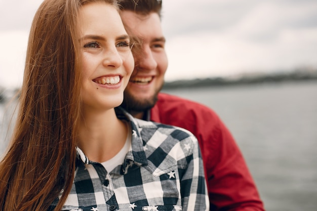 Beautiful couple spend time in a summer park