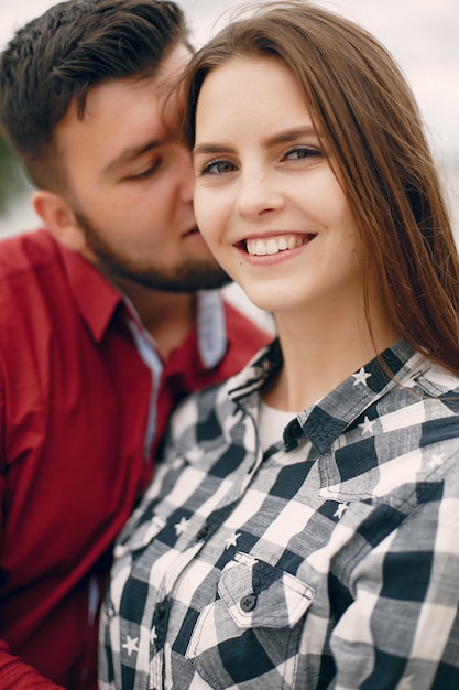 Beautiful couple spend time in a summer park