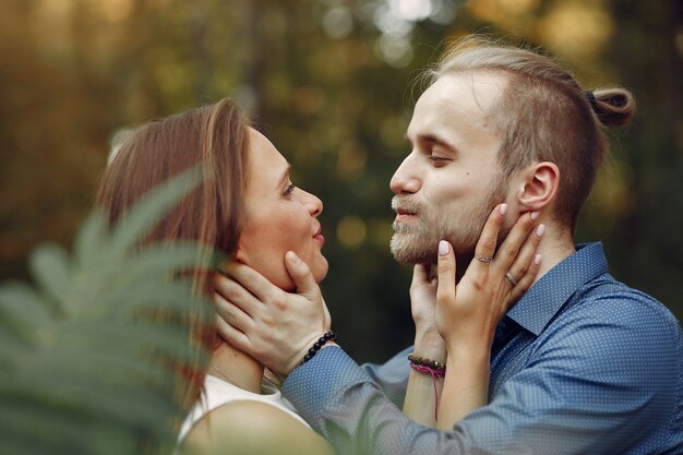 Beautiful couple spend time in a summer park