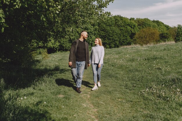 Beautiful couple spend time in a summer park