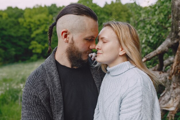 Beautiful couple spend time in a summer park