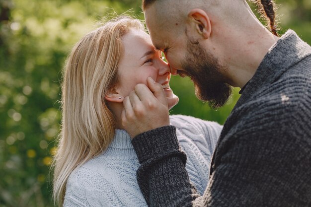 Beautiful couple spend time in a summer park