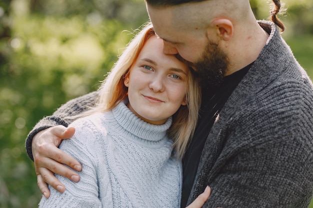 Beautiful couple spend time in a summer park