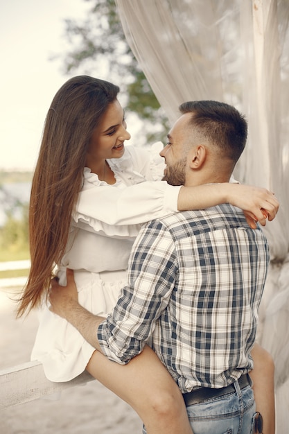 Beautiful couple spend time in a summer park