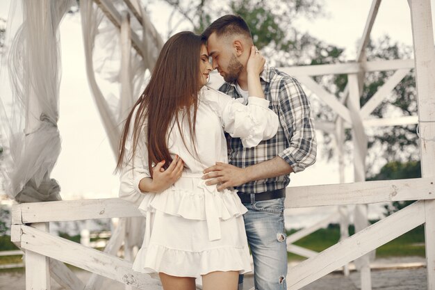 Beautiful couple spend time in a summer park