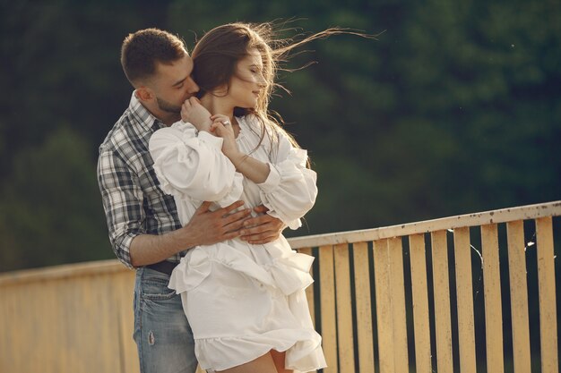 Beautiful couple spend time in a summer park