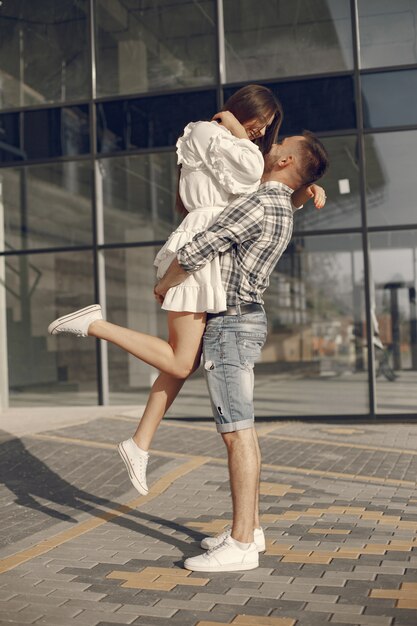 Beautiful couple spend time in a summer park