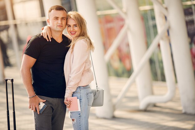 Beautiful couple standing in airport