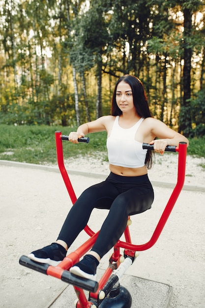 Beautiful couple training in a summer park