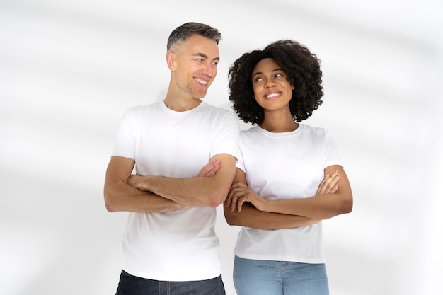 Free photo beautiful couple wearing blank shirt mockup