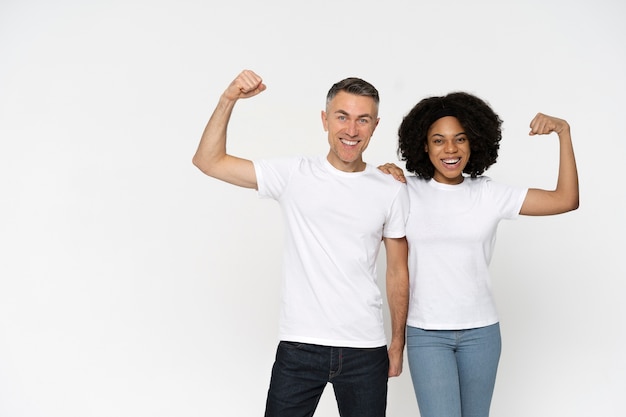 Free photo beautiful couple wearing blank shirt mockup