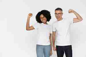 Free photo beautiful couple wearing blank shirt mockup