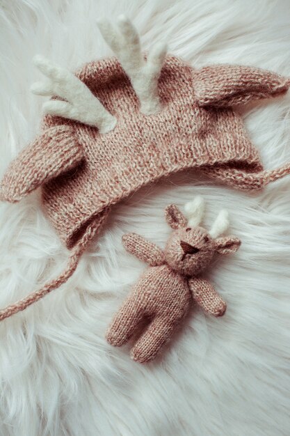 Beautiful cute baby's hat and toy close-up