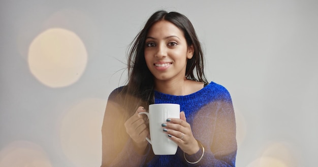 Free photo beautiful dark haired girl in a toasty fluffy sweater with lens flare on white background