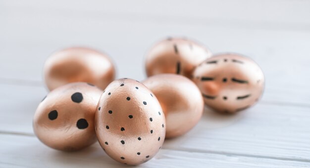 Beautiful decorated Easter eggs of Golden color .