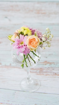 Beautiful and delicate flower arrangement in a glass image with selective focus
