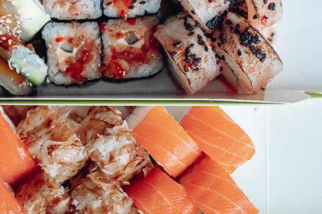 Free photo beautiful delicious sushi sushi delivery advertising sushi rolls made of fish and cheese