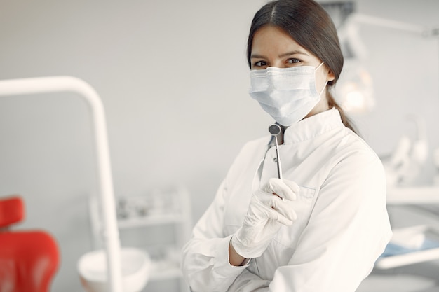 Beautiful dentist working on a dental clinic