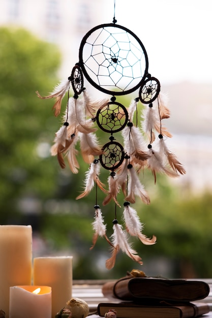 Free photo beautiful dream catcher and candles outdoors
