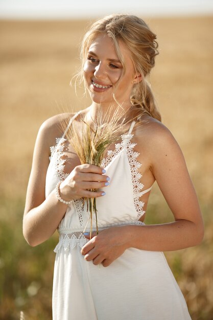 Beautiful elegant girl in a autumn field