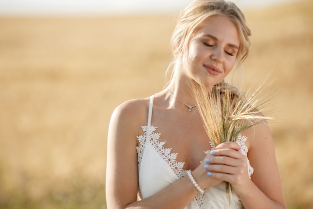 Beautiful elegant girl in a autumn field