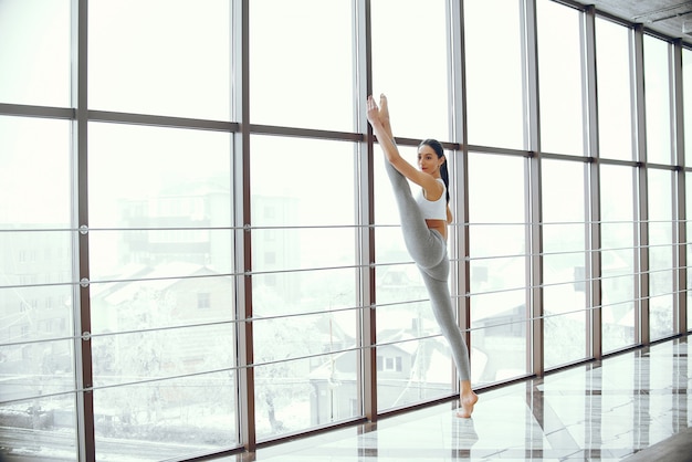 Beautiful and elegant girl doing yoga