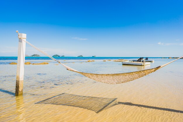 Beautiful empty hammock around tropical beach sea ocean for holiday vacation