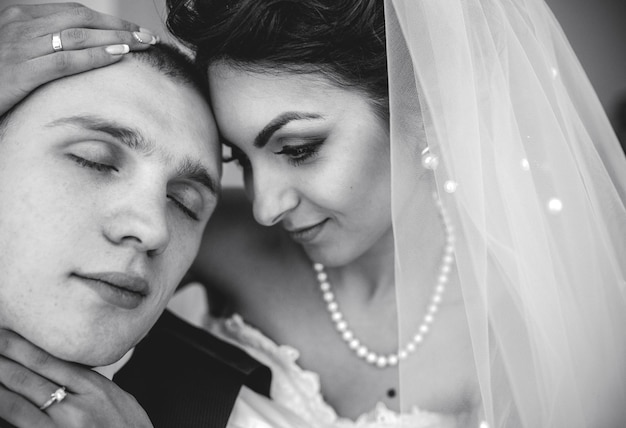 Beautiful European bridal couple in the hotel room