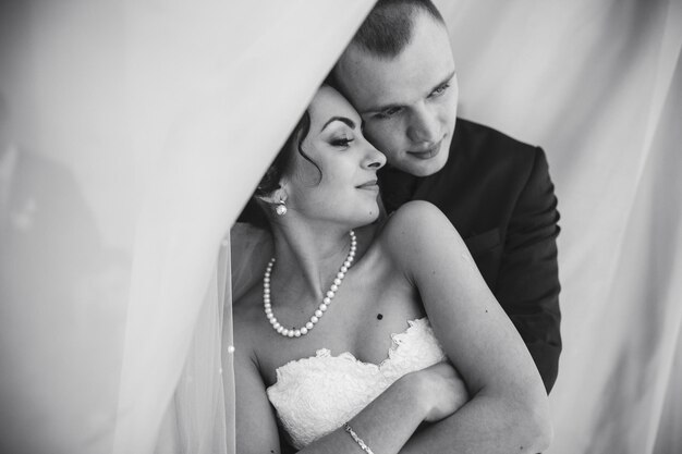 Beautiful European bridal couple in the hotel room