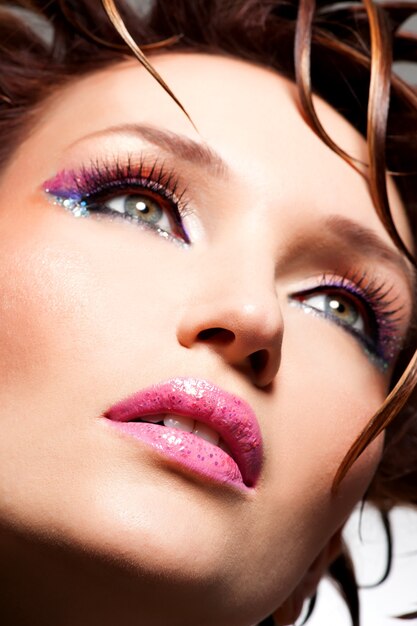 Beautiful face of a glamour woman with fashion bright makeup