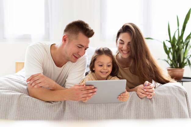 Beautiful family looking at a tablet