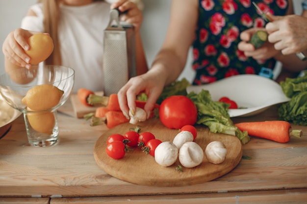 Beautiful family prepare food in a kitchen