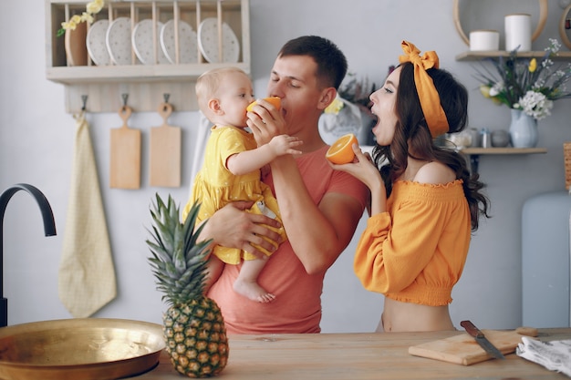 Beautiful family prepare food in a kitchen