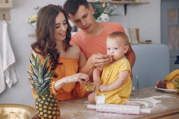 Beautiful family prepare food in a kitchen