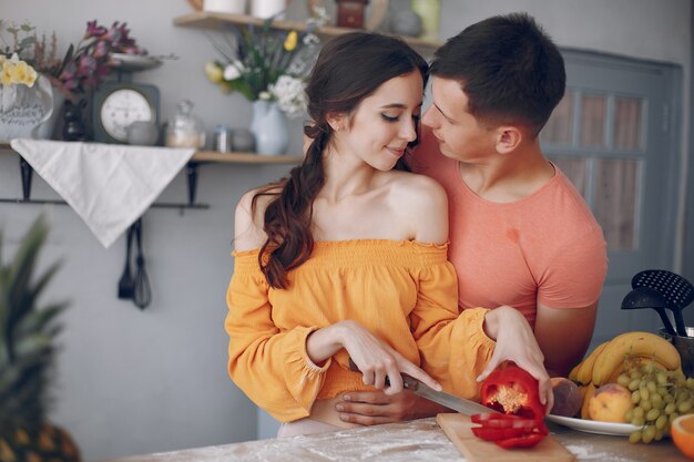 Beautiful family prepare food in a kitchen