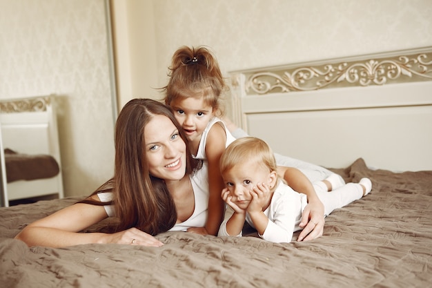 Beautiful family spend time in a bathroom