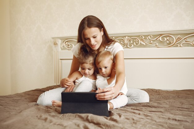 Beautiful family spend time in a bathroom