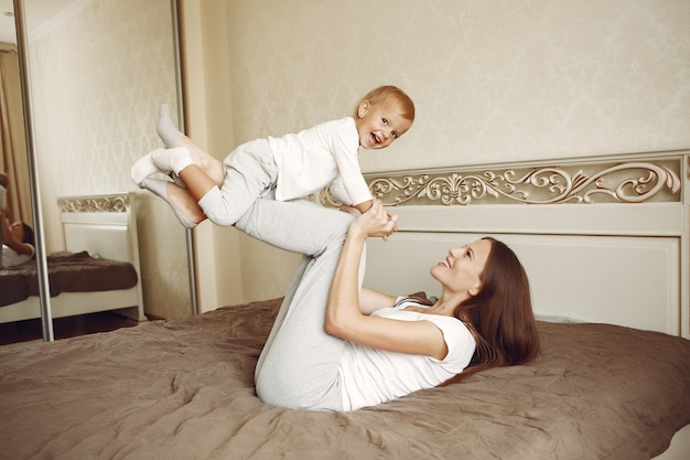 Beautiful family spend time in a bathroom