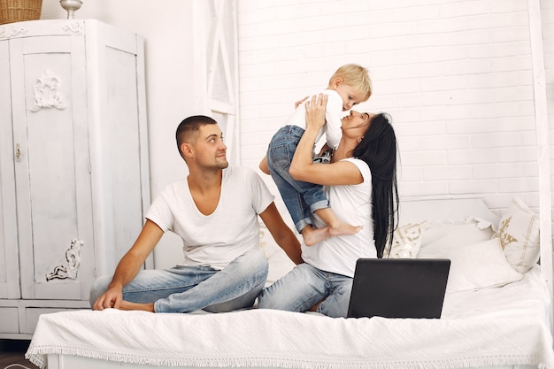 Beautiful family spend time in a bedroom