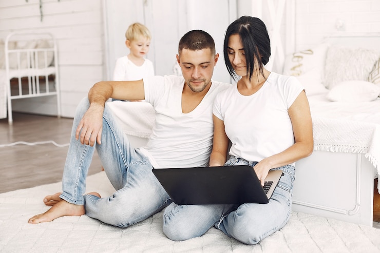 Free Photo beautiful family spend time in a bedroom
