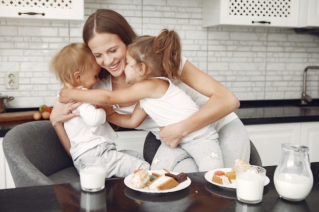 Beautiful family spend time in a kitchen